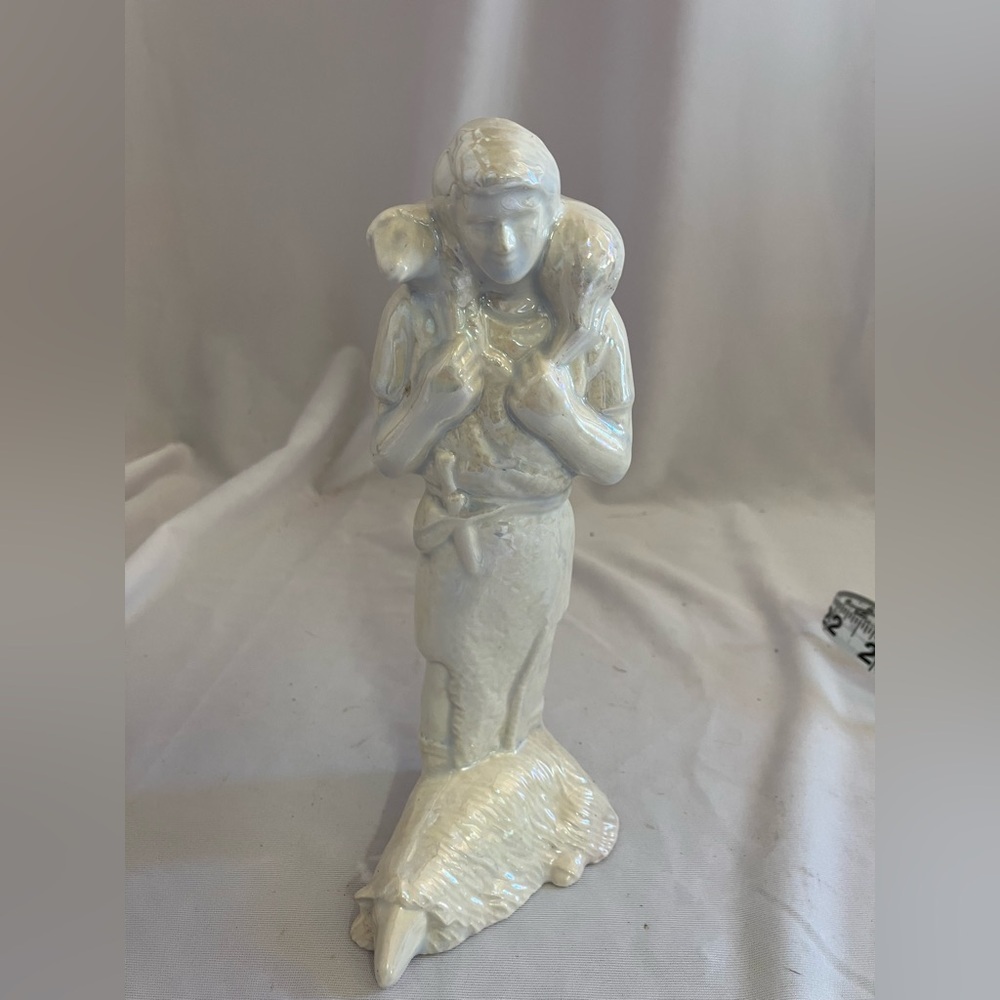 Serene White Ceramic Shepherd Sculpture